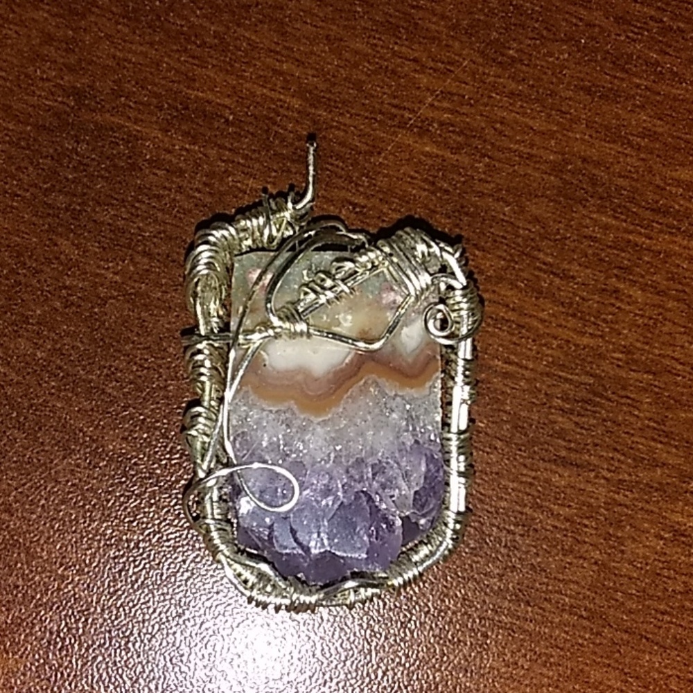 Amethyst slice wrapped in silver plated wire.